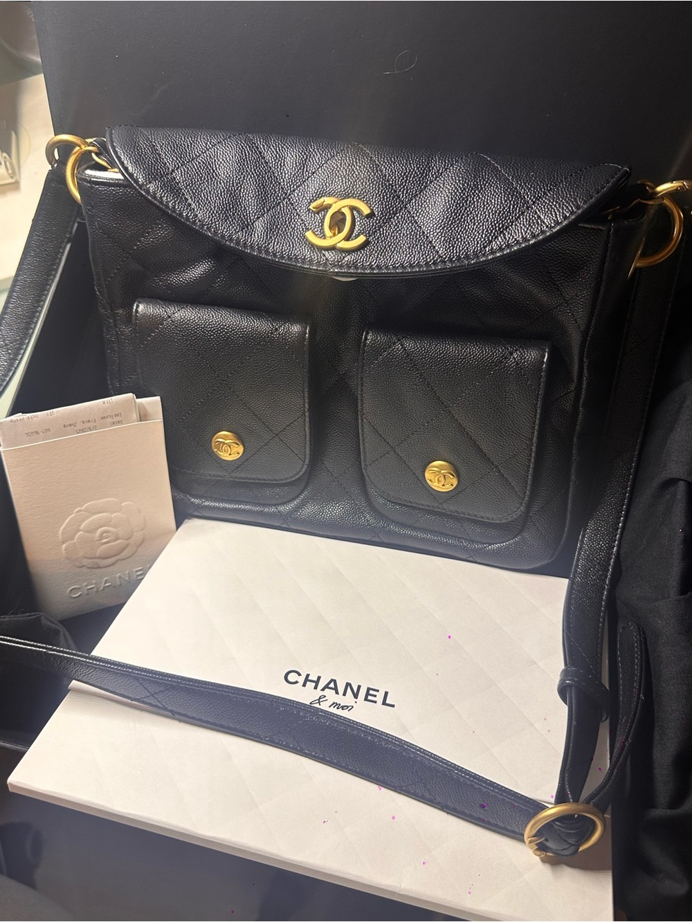 CHANEL Black Quilted Leather Shoulder Bag with Gold Hardware and Front Pockets